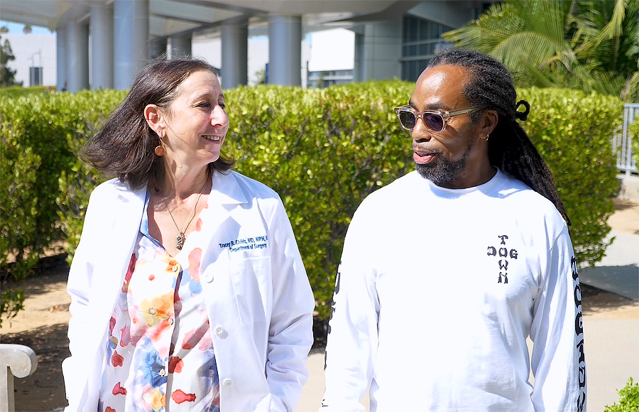 Dr. Childs walks with Elridge Cavitt, Cancer Survivor