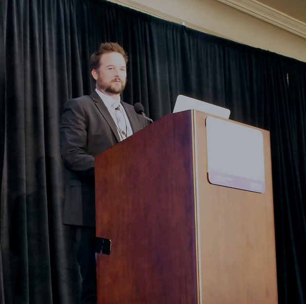 Dr. Trevan Fischer at the podium - Santa Monica Melanoma Symposium 