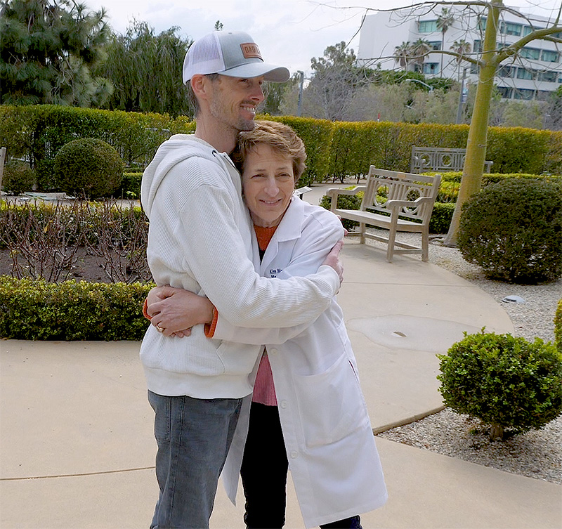 Dr. Kim Margolin embraces Airforce Veteran and cancer survivor, Michael Antonson
