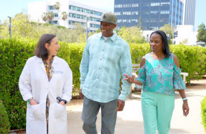 Dr. Tracey Childs walks with Wade and Marilyn Stevenson
