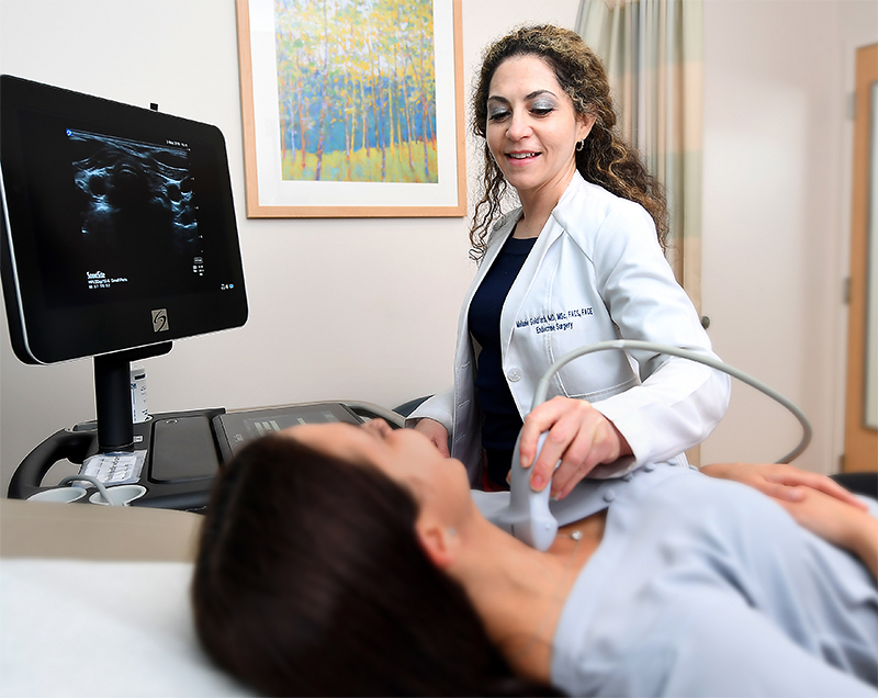Dr. Melanie Goldfarb performs a routine untrasound to evaluate thyroid conditions.