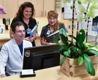 Doctor talking with nurses