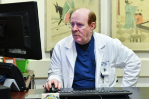 Dr. McKenna working at his computer