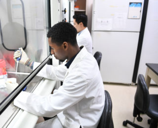 JWCI Translational Molecular Medicine Researchers working beside each other in the lab