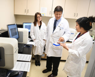 JWCI Translational Molecular Medicine researchers reviewing data