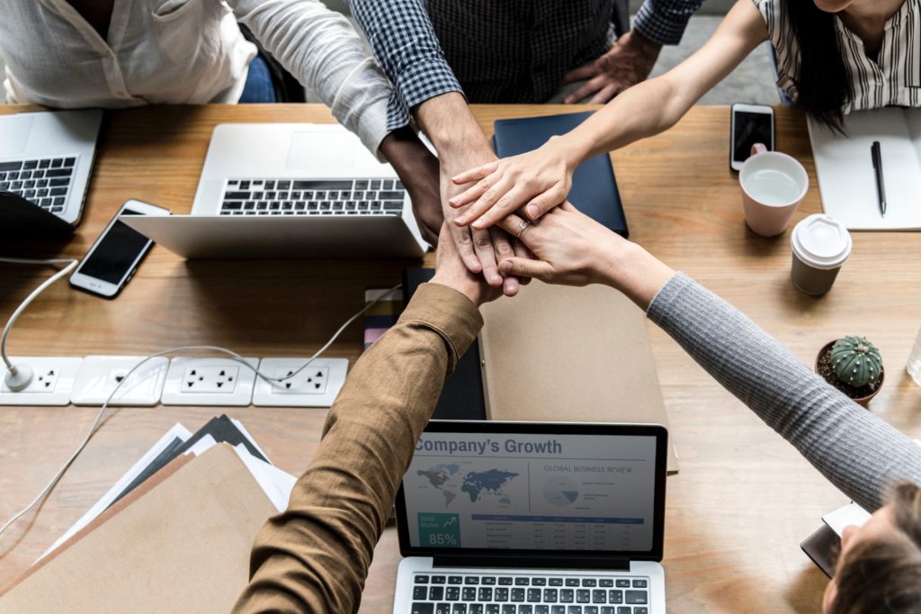 business deal huddle