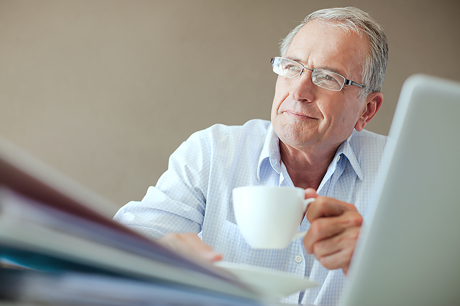 Older man working at desk